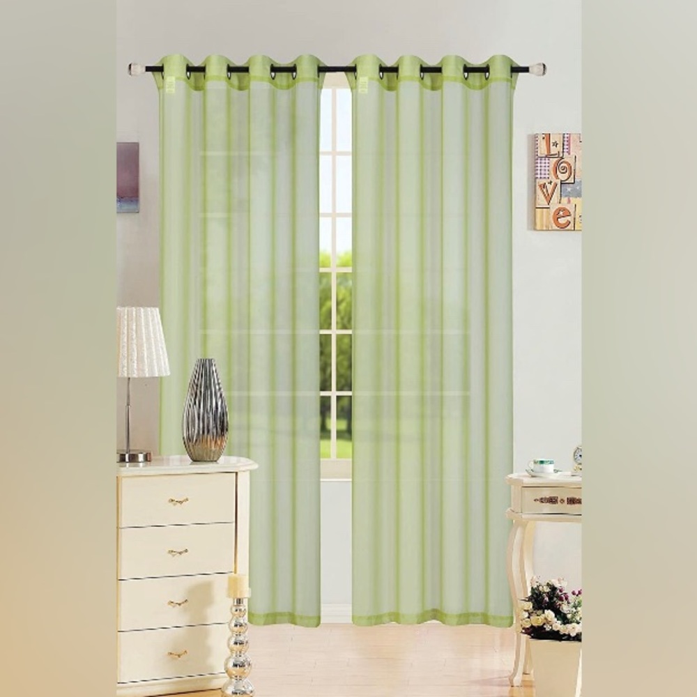 Sheer grommet top curtain panel. Sage green with brushed bronze grommets.